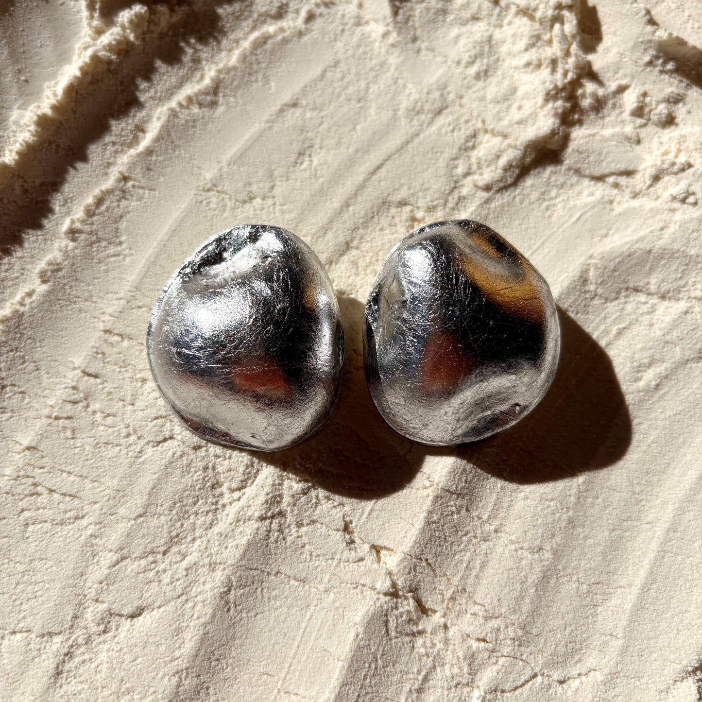 A Reflective Stone (brushed silver)